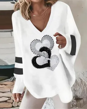 Long-sleeved casual top featuring a heart print